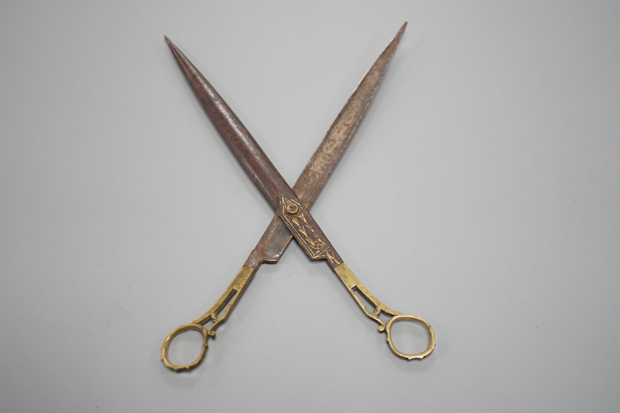 A pair of Ottoman gold damascened iron scissors, 23 cms long.